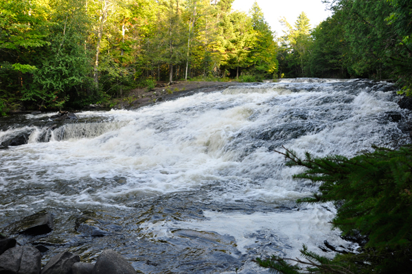 the falls curving over a flat area